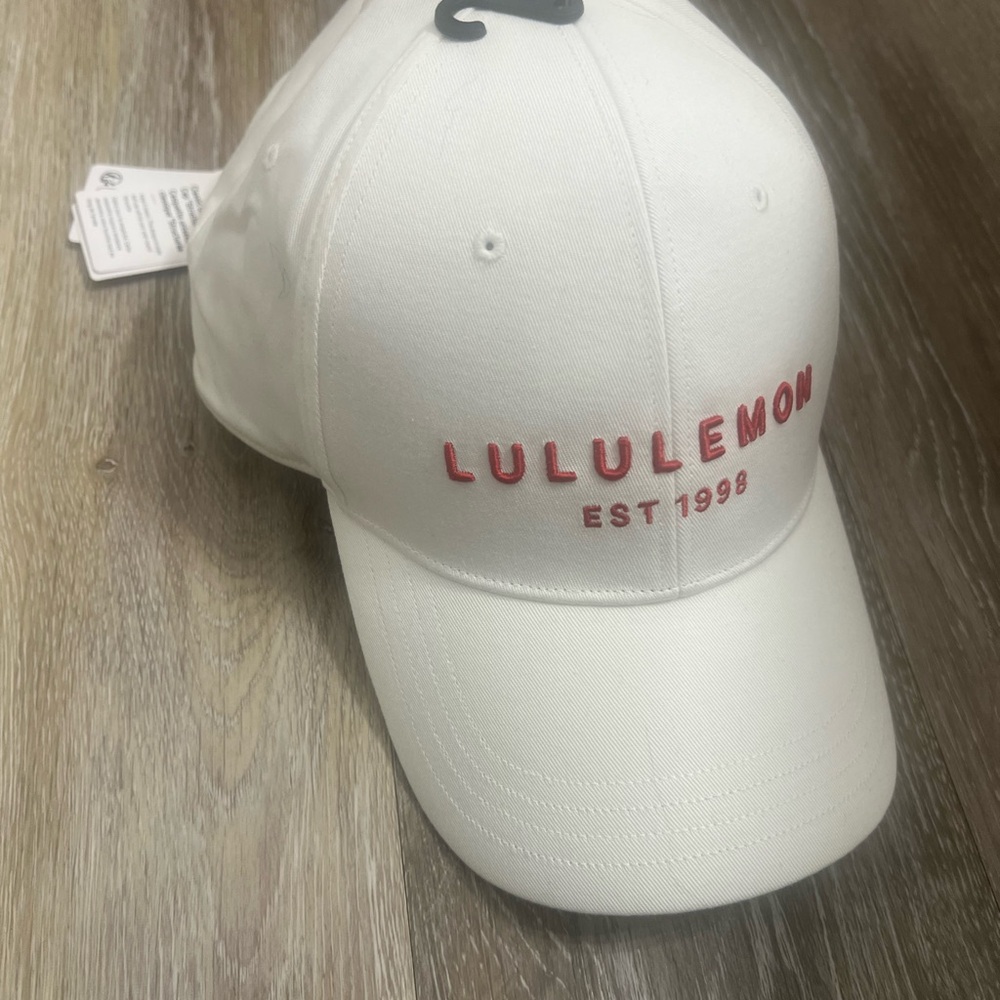 NWT Lululemon White Baseball Cap with red Logo